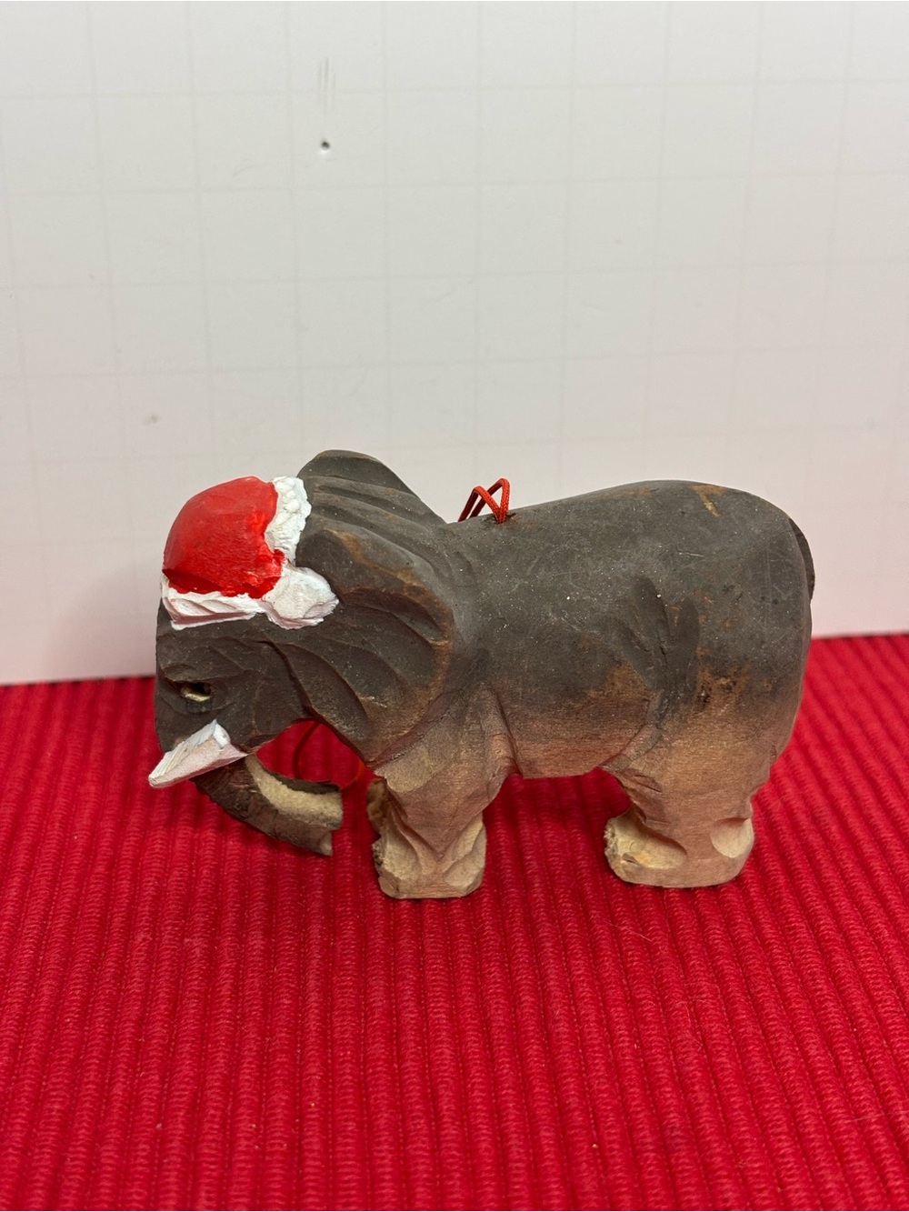 Hand-Carved Wooden Elephant Christmas Ornament with Red Santa Hat